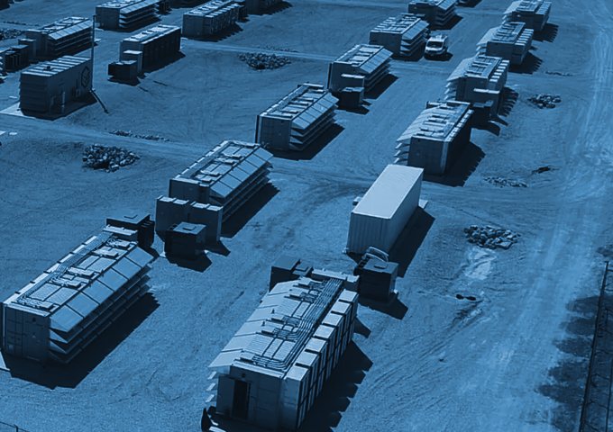 Rows of load containers on a gravel pad at an operating site